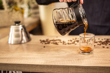 Cropped shot of barista preparing coffee in coffee shop copy space, stock image, top list