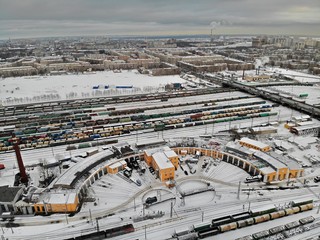 Saint-Petersburg / Russia - 03.12.19: Aerial view at winter from the top Classification marshalling yard trains and railroad. Railway turntable with steam locomotives and wagons