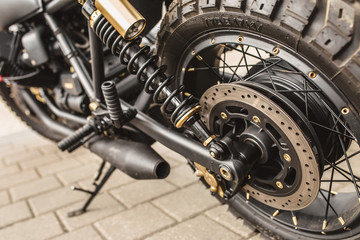 Suspension parts, disc brake system and rear wheel of a motorcycle