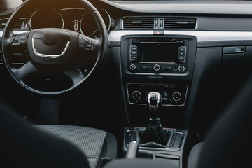 Car interior with steering wheel.