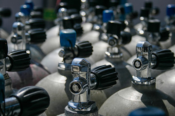 Rows of scuba tanks in close up