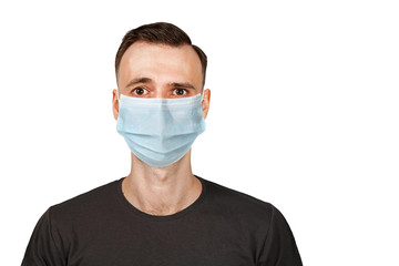 Unhappy, sad young man wearing a protective face mask prevent virus infection or pollution on white isolated background