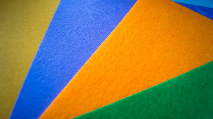 Shreds of colored felt piled on top of each other. Use as background. Material for crafts. Handmade concept. Clothing industry.