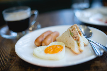 Sandwiches, Fried Eggs and Sausages Breakfast for hotel guests
