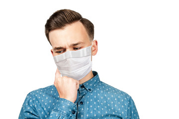 Sick guy looking at the camera with a surprised medical mask. Virus protection during influenza epidemic. corona virus