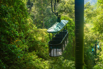 Cable car cabin riding through the tropical rainforest near Jaco in Costa Rica