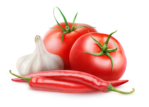 Isolated arrabbiata sauce ingredients. Two fresh tomatoes, red hot peppers and a head of garlic isolated on white background with clipping path
