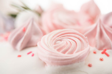 Close up view of delicious easter cake with pink meringue