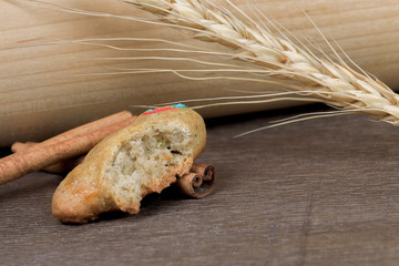 Soft homemade shortbread cookies, tasty and warm. Gingerbread man, from which a piece was bitten off. Rustic christmas style recipe