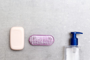 Hand sanitiser gel soap and nail brush for washing hands