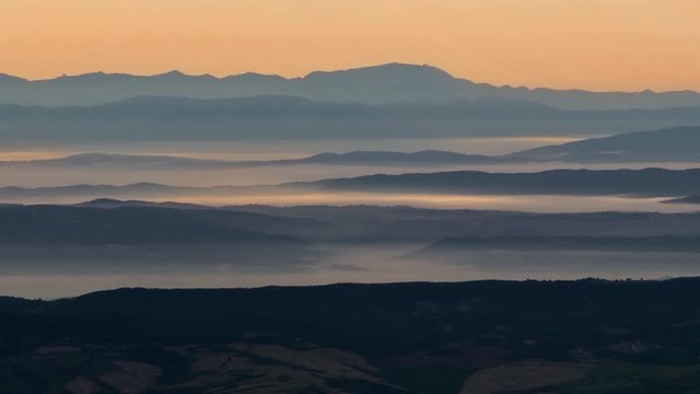 Panoramic of a landscape with clouds taken from the top of Mount Amiata in Tuscany Italy