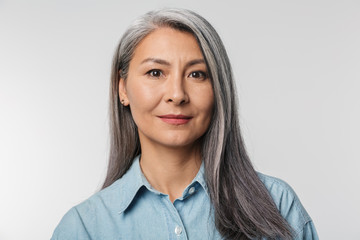 Image of adult mature woman with long white hair looking at camera