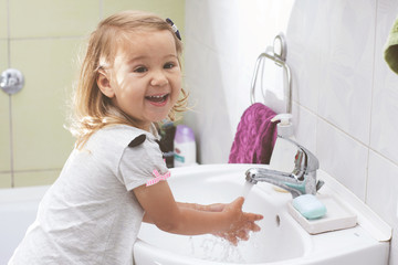 Smiling Child Washing Hands With Soap Hygiene Concept