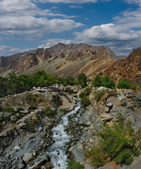 Fototapeta na wymiar Tajikistan. The right tributary of the border river Panj along the Pamir tract near the city of Khorog