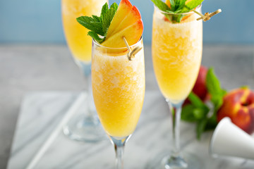 Summertime peach mimosas or bellinis