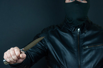 knife in the masked bandit's hand