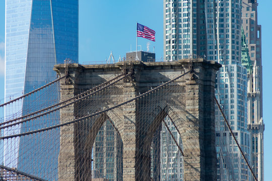Arches on the Brooklyn Bridge with an American Flag in New York City