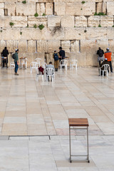 People praying and grieving at the Western Wall in Jerusalem