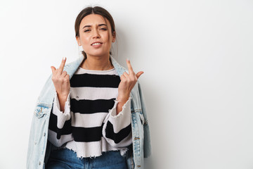 Image of young sassy woman showing middle fingers at camera
