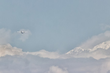 The plane is flying in the clouds, copy space for design. blurring the photo is my idea