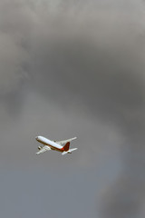 The plane is flying in the clouds, copy space for design. blurring the photo is my idea