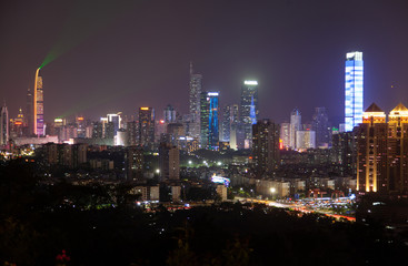 Fototapeta na wymiar Shenzhen with illumination and flashing lasers