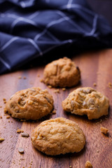 Cookies is on wooden plate. 