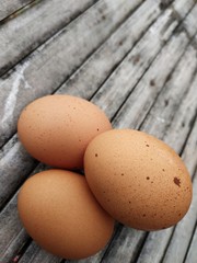 chicken eggs on a bamboo board