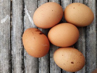 chicken eggs on a bamboo board