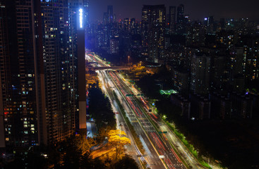 Fototapeta na wymiar Shenzhen vehicles drive along wide highway