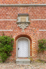 Fototapeta na wymiar Little white door of the historic castle in Husum, Germany