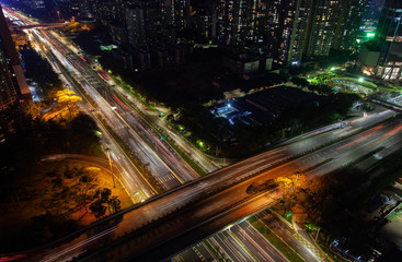 Fototapeta na wymiar illuminated overpass road over highway in Shenzhen