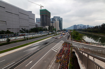Shenzhen highway with heavy traffic by calm river