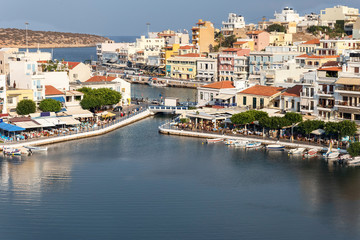 Fototapeta na wymiar top view of a quiet bay and the Greek resort town of Agios Nikolaos on a sunny summer day