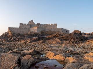 A beautiful Fort National on island in St-Malo. St-Malo, Brittany, by the sunset