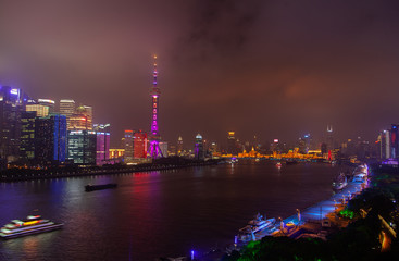 Large famous Shanghai tower reflected in Huangpu 