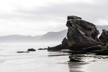 Rocky coast of the misty sea © eszain_creative