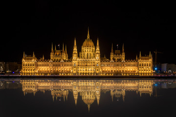 hungarian parliament building, with a great reflection in the water.  a nice detailed night shot