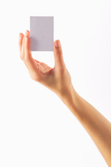 Empty paper card in woman hand