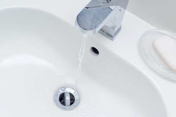 Modern bathroom sink in white home interior