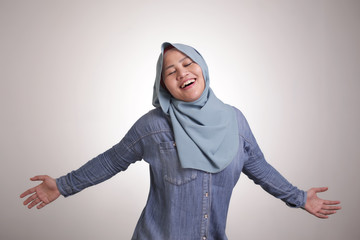 Happy Funny Asian Muslim Woman Dancing Full of Joy