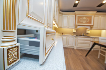 Furniture of the classic italian kitchen. Modern style. Design background. Home decoration. Modern home interior. Modern kitchen design in a light interior. Wood cupboard. Italian kitchen furniture .