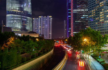 Fototapeta na wymiar Night traffic on Pudong New Area highway in China 