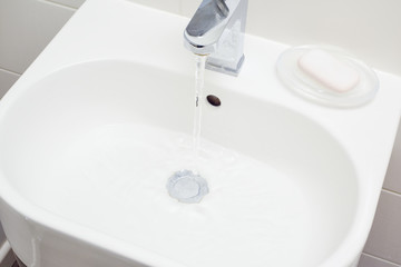 Modern bathroom sink in white home interior