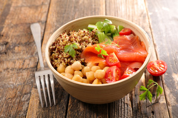 buddha bowl- vegetable salad with smoked salmon in bowl