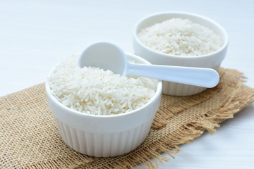 Natural raw white rice grains, on display in bowl