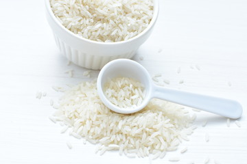 Natural raw white rice grains, on display in bowl