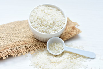 Natural raw white rice grains, on display in bowl