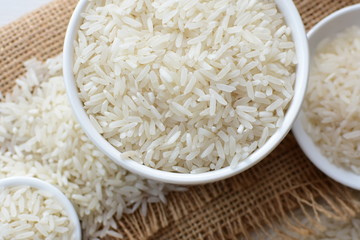Natural raw white rice grains, on display in bowl