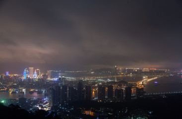 Fototapeta na wymiar Macau Peninsula night districts by bridge in China 